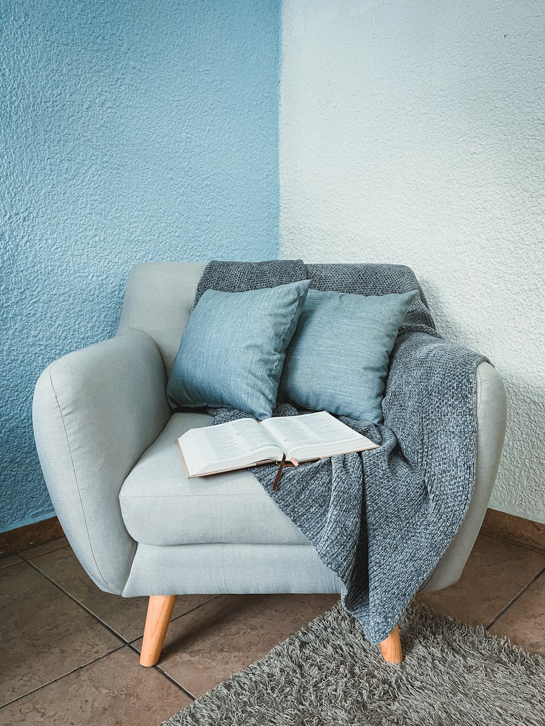 Photo by Marlon Corona gray sofa with throw pillows