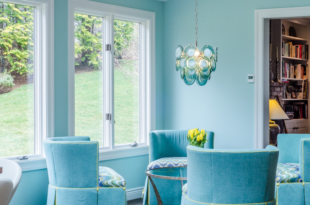 Photo by Chastity Cortijo blue and gray padded armchairs